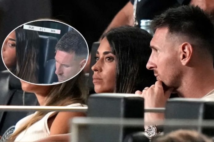 Foto: Antonela Roccuzzo intentando ver el celular de Messi /Cortesía